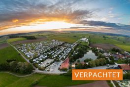 Luftaufnahme Campingplatz Franken bei Sonnenuntergang mit Verpachtet-Hinweis